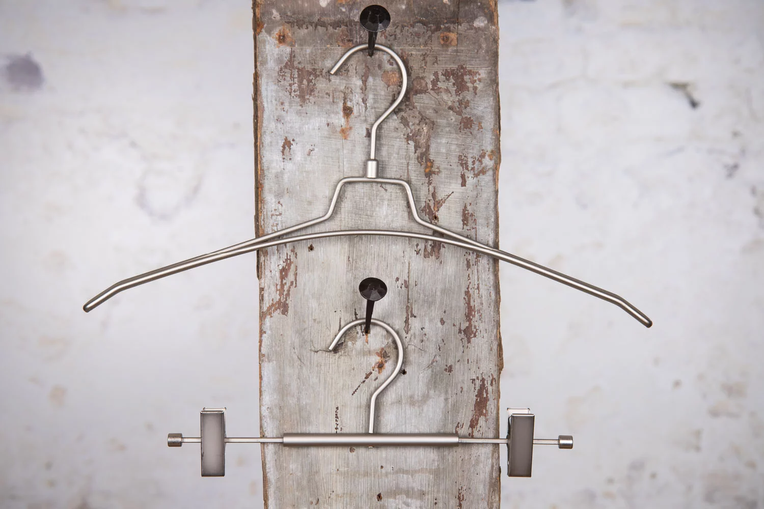 Metal clothes hanger with hangers and clips – minimalistic design for hotels and shops.