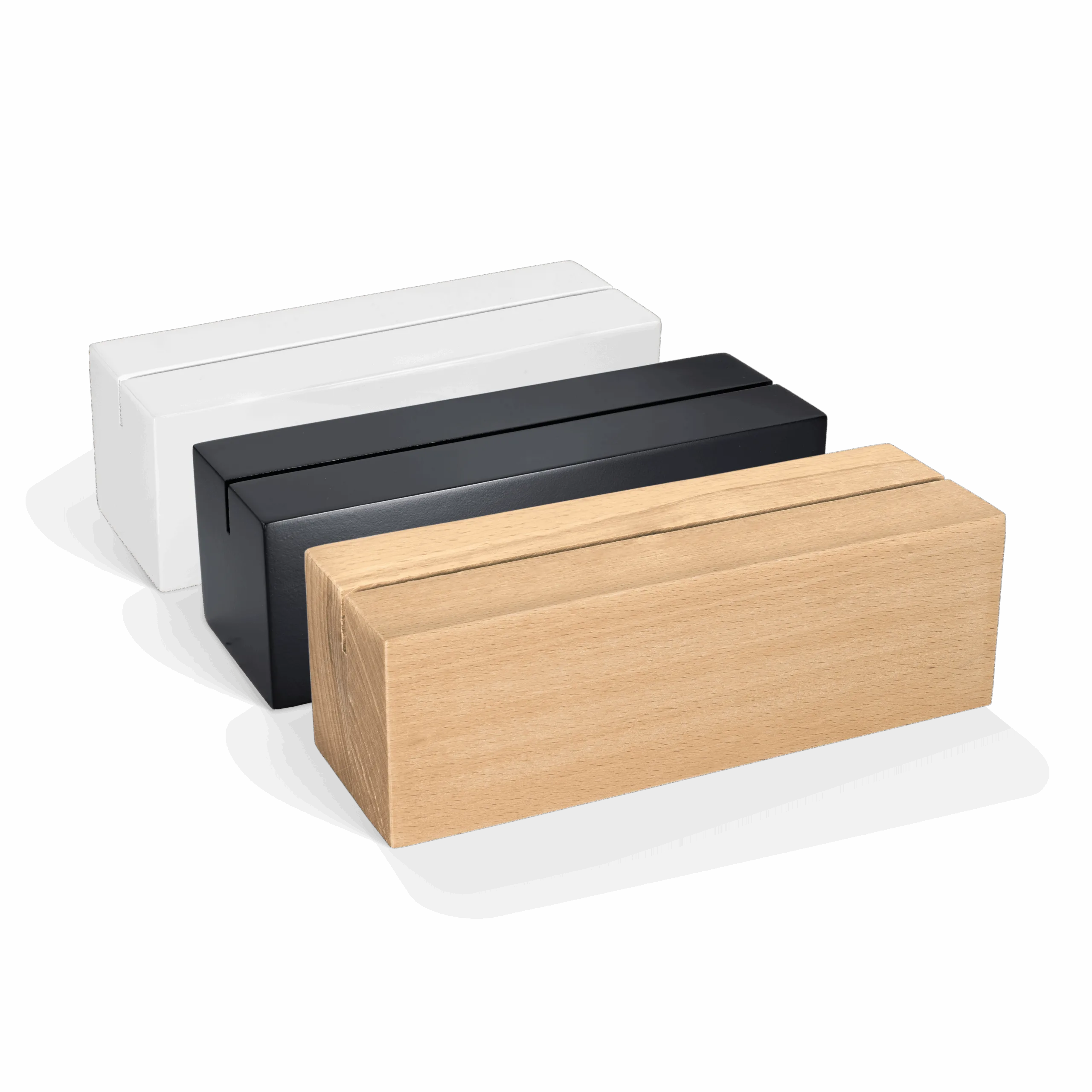 Wooden logo blocks in white, black and natural finish placed side by side on a white background, suitable for professional signage, visual merchandising and branding in stores, showrooms and trade shows.