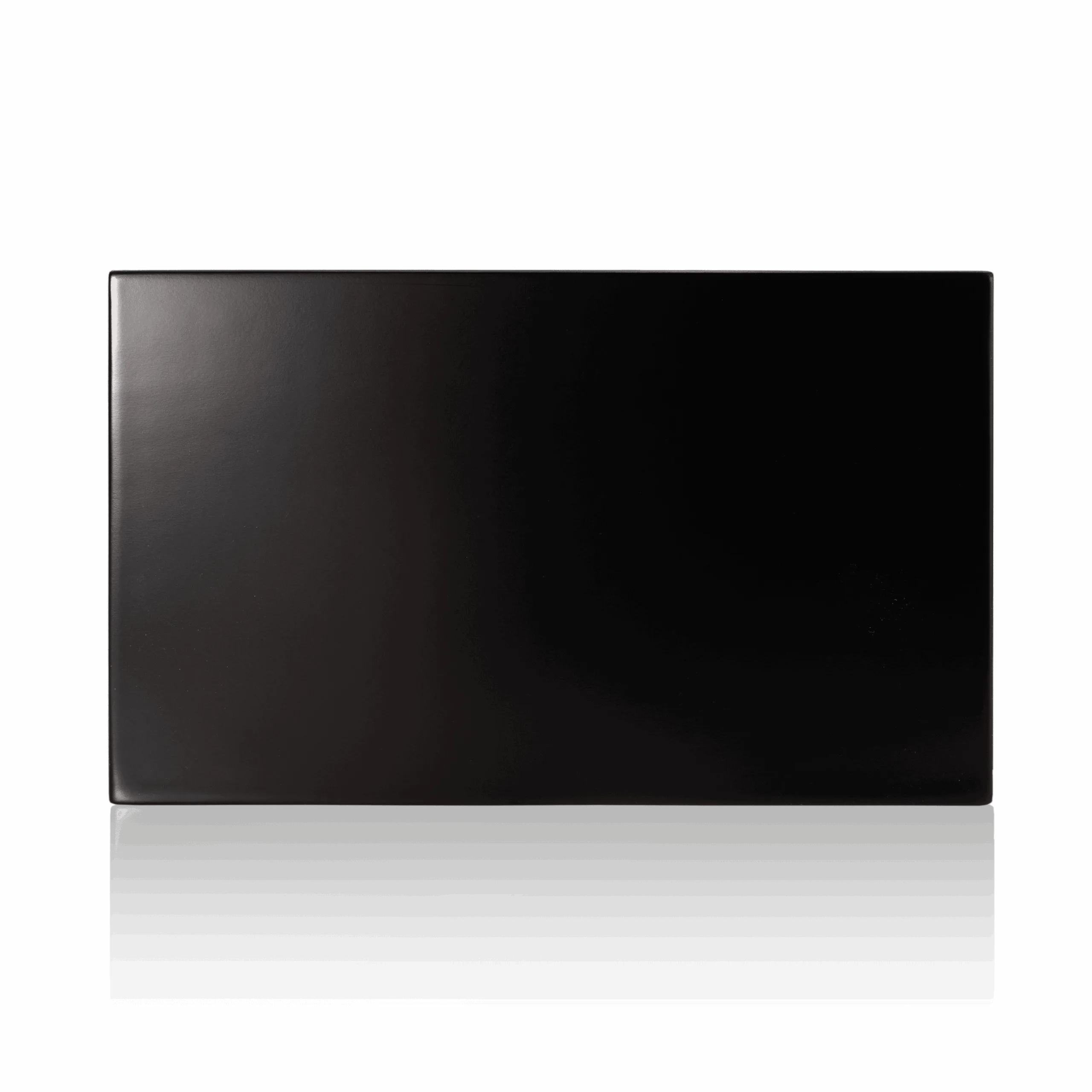 Black logo block with matt lacquered surface, right side view.