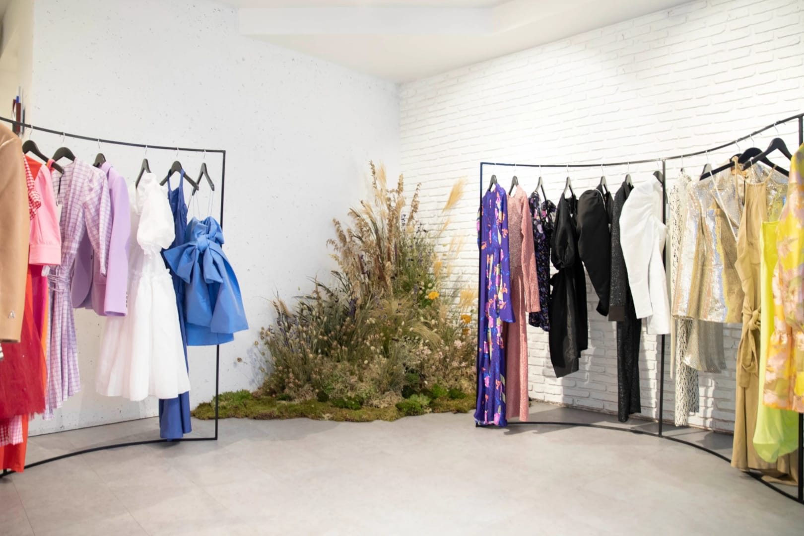 Showroom with professional presentation of clothes on hangers, illustrating collection display and brand environment for B2B